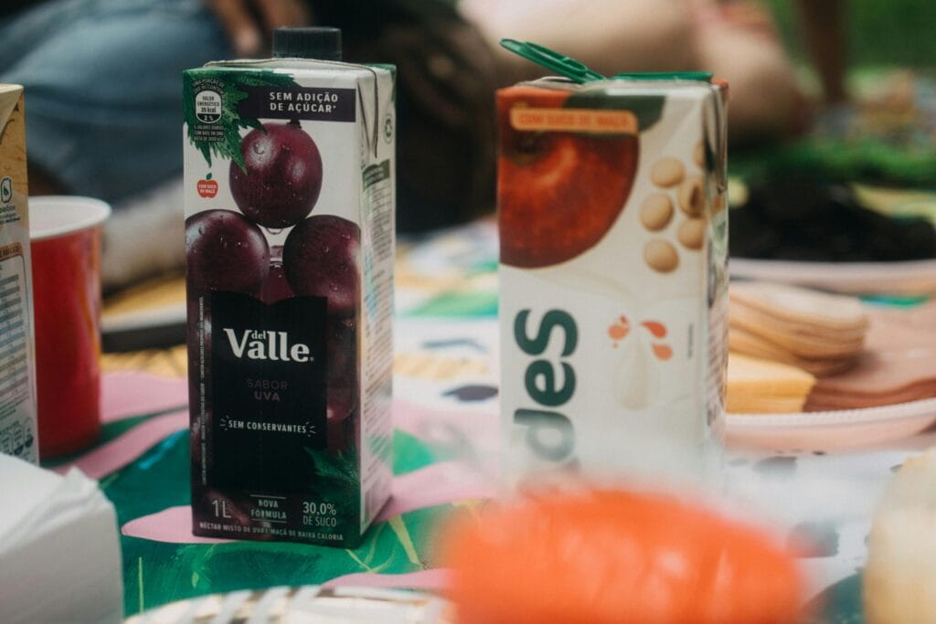 Tetrapak packaged fruit juice labelled 'no added sugar' — a fake healthy food in India with 22g free sugar and zero fibre, classified NOVA 4