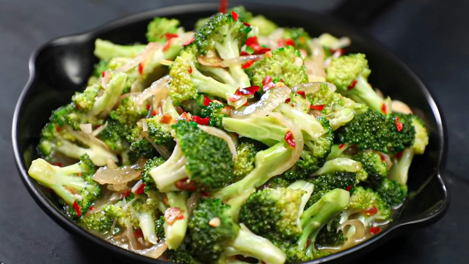 Broccoli stir-fry in Indian style — garlic and spice preparation